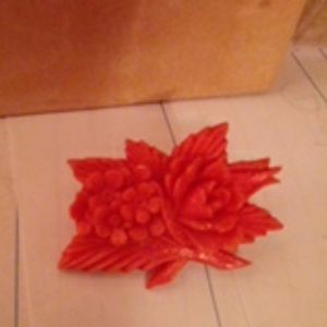 Antique Flowers craved out of red/orange coral